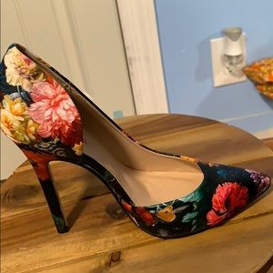 Multi colored floral heels. Never worn out. New!